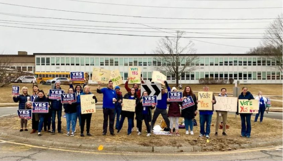 Activists urging a YES vote for an upcoming override